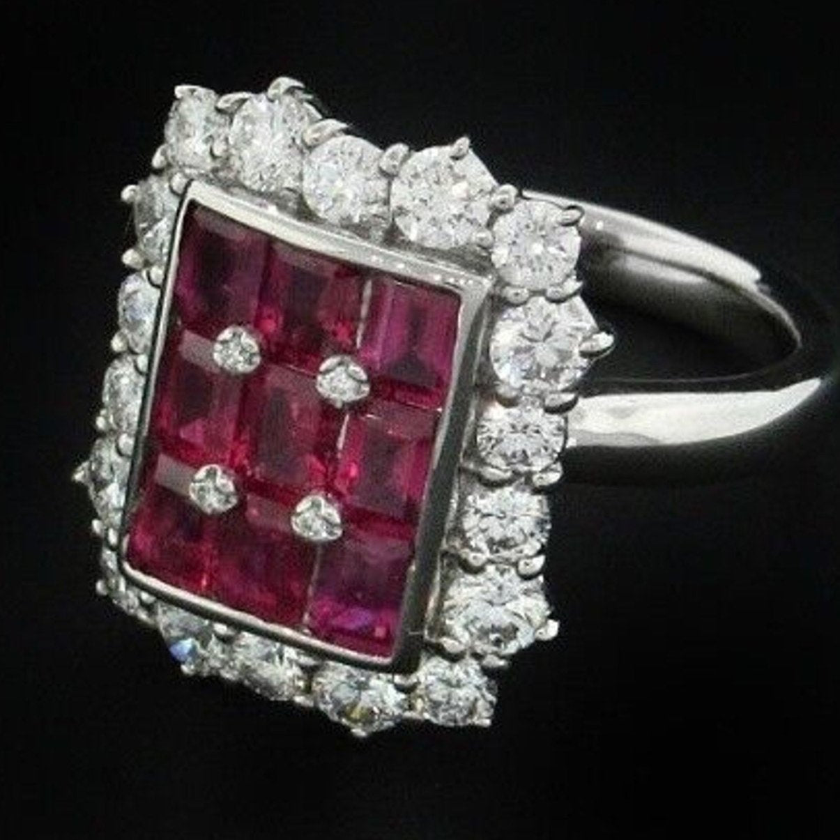 3.21 carats Ruby Baguette and Round Diamond Ring in Platinum