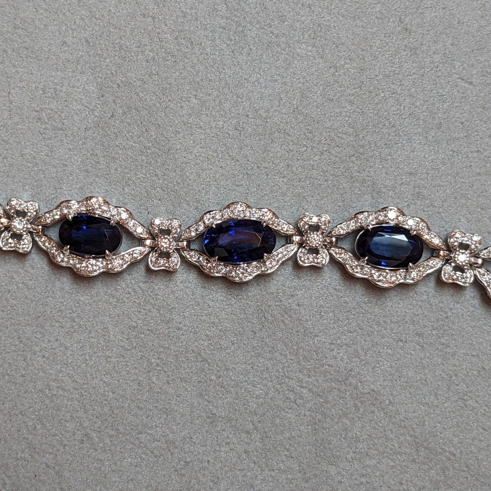 Blue Sapphire and Diamond Station Bracelet with Bows in Platinum