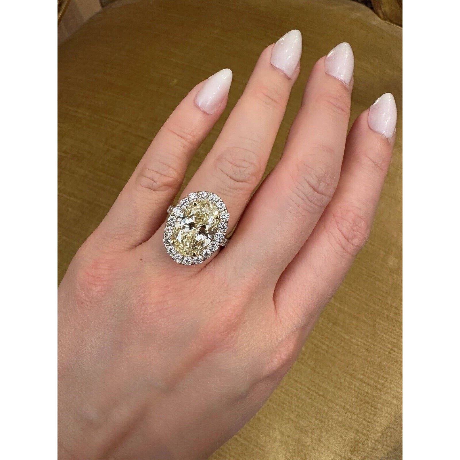 GIA 6.05 carat Oval Brilliant Yellow Diamond Halo Ring in 18k Gold - C300EB