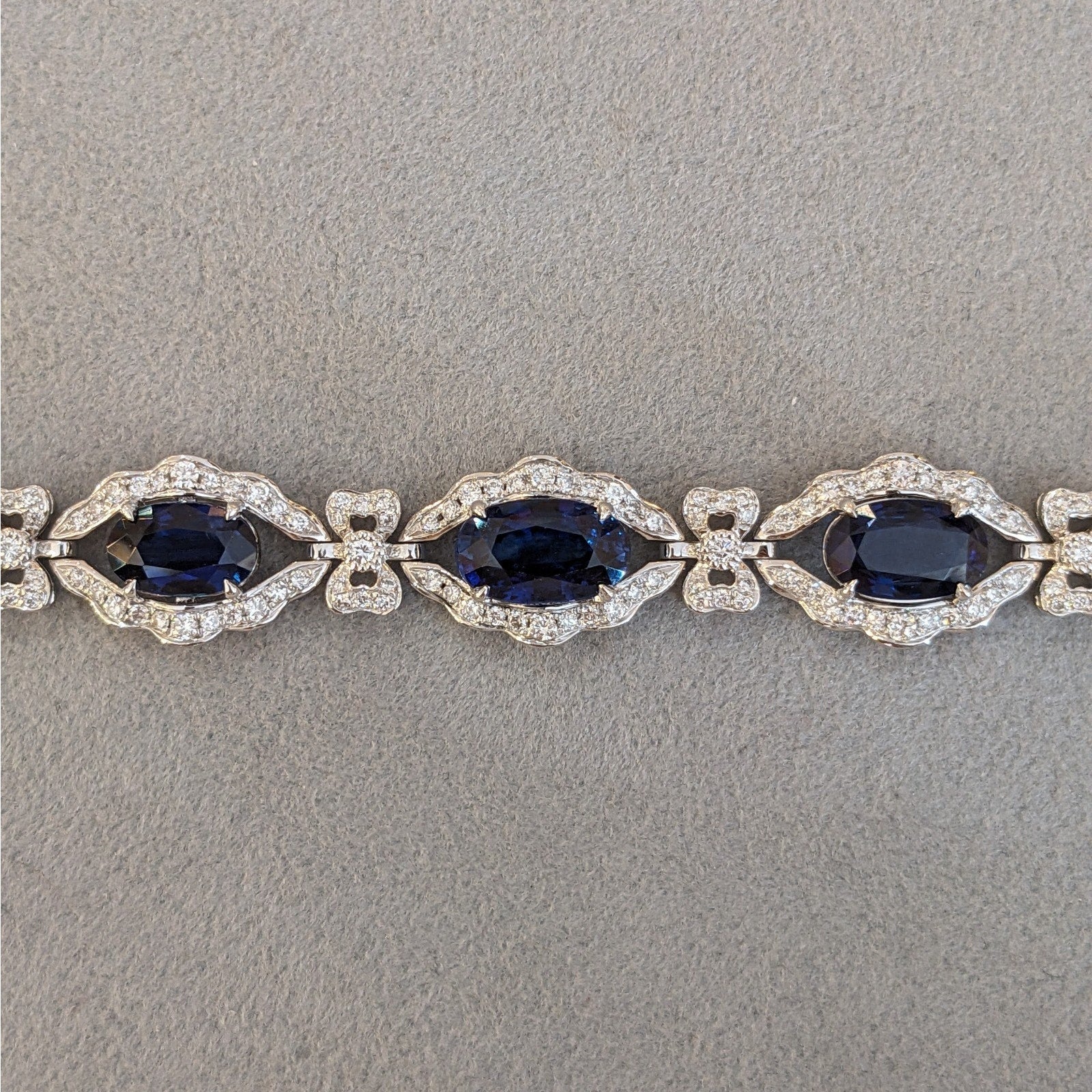 Blue Sapphire and Diamond Station Bracelet with Bows in Platinum