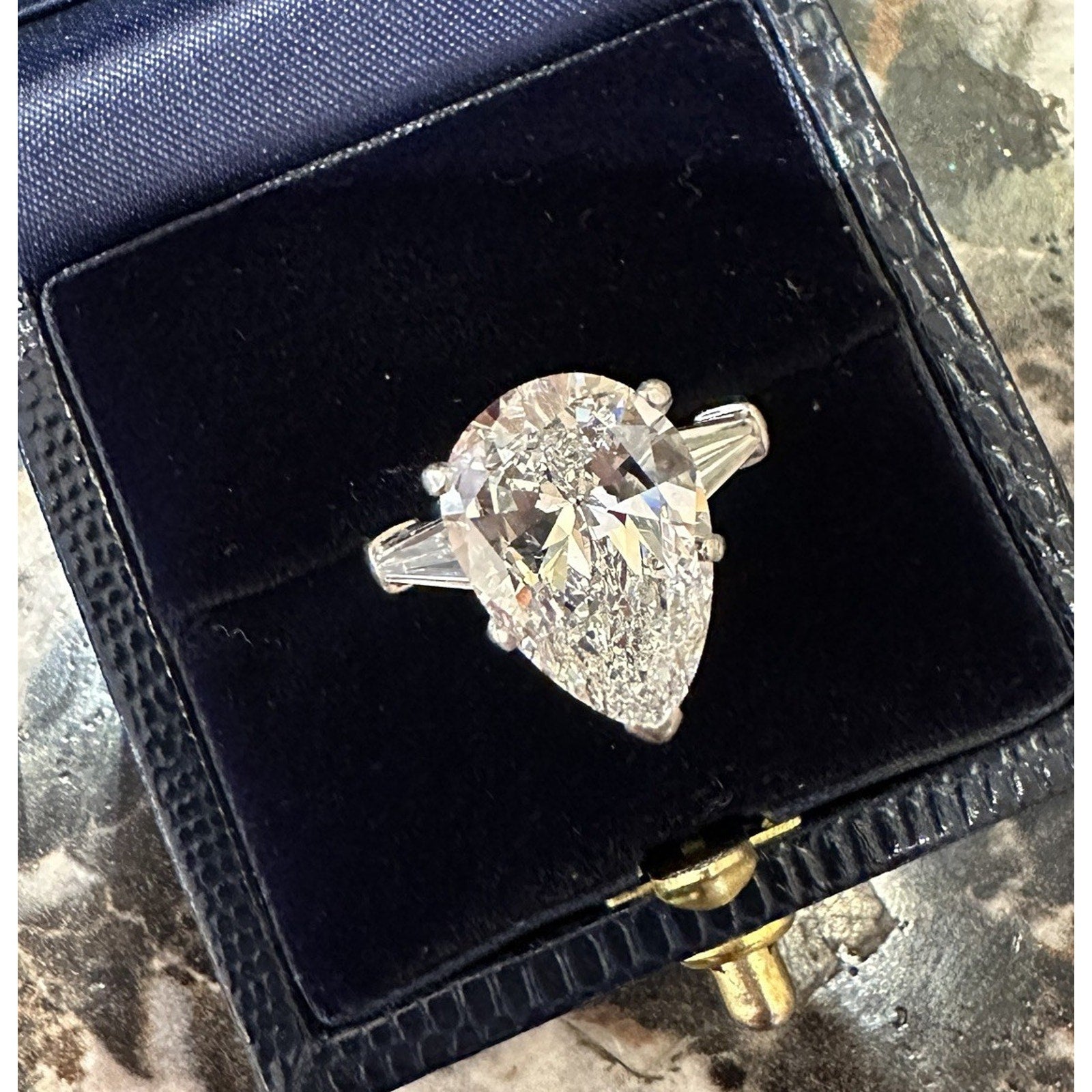GIA 5.01 carat H-SI1 Pear Shape Diamond Three-Stone Ring in Platinum
