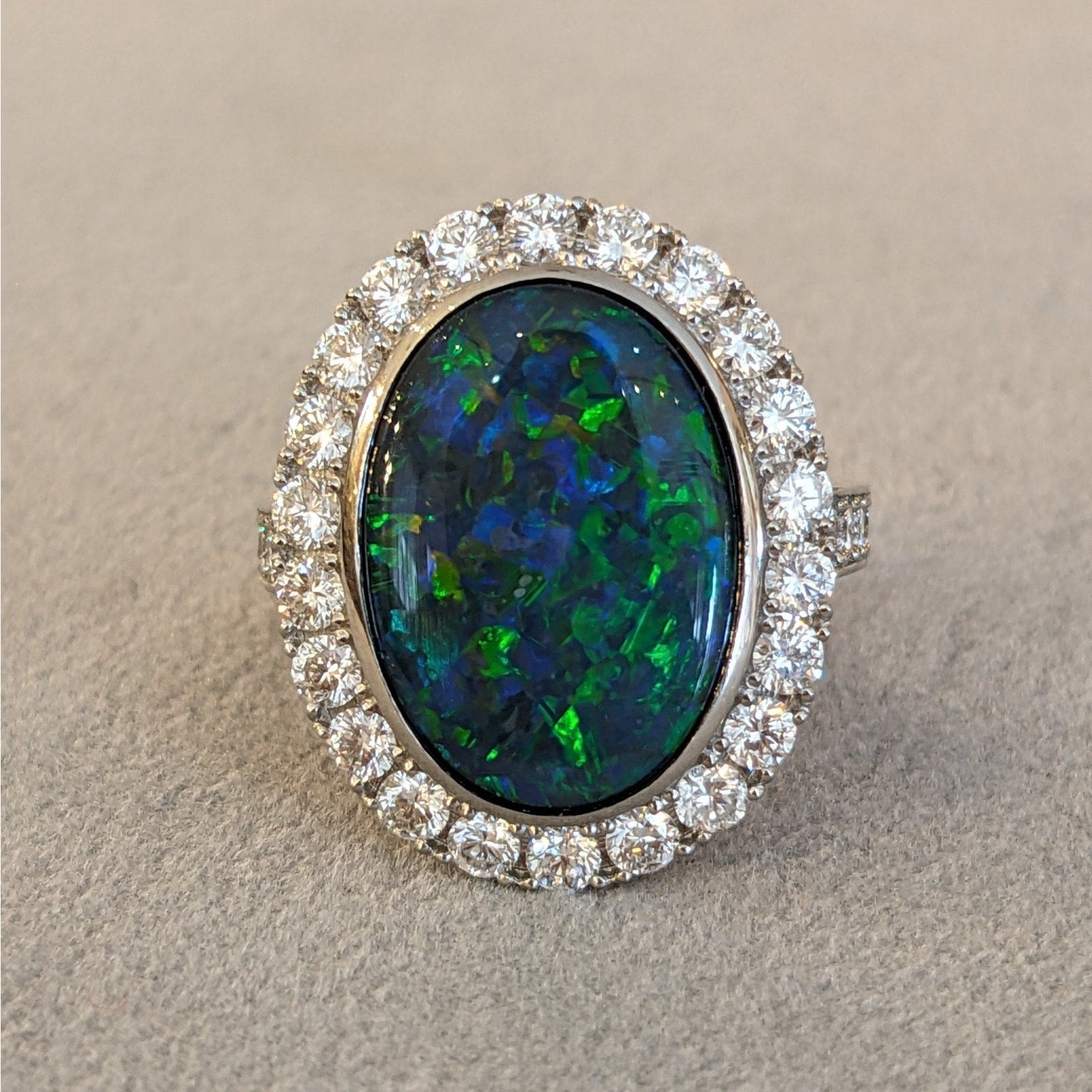 6.31 cts. Natural Black Opal and Diamond Halo Ring in Platinum