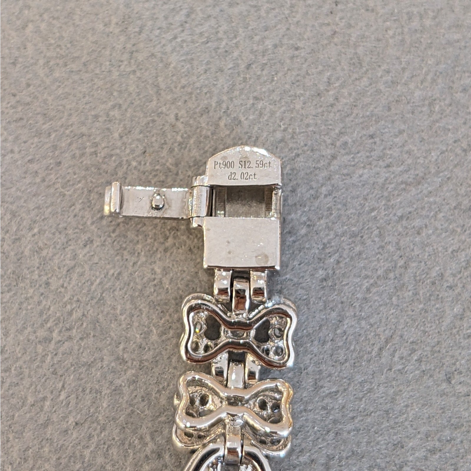 Blue Sapphire and Diamond Station Bracelet with Bows in Platinum