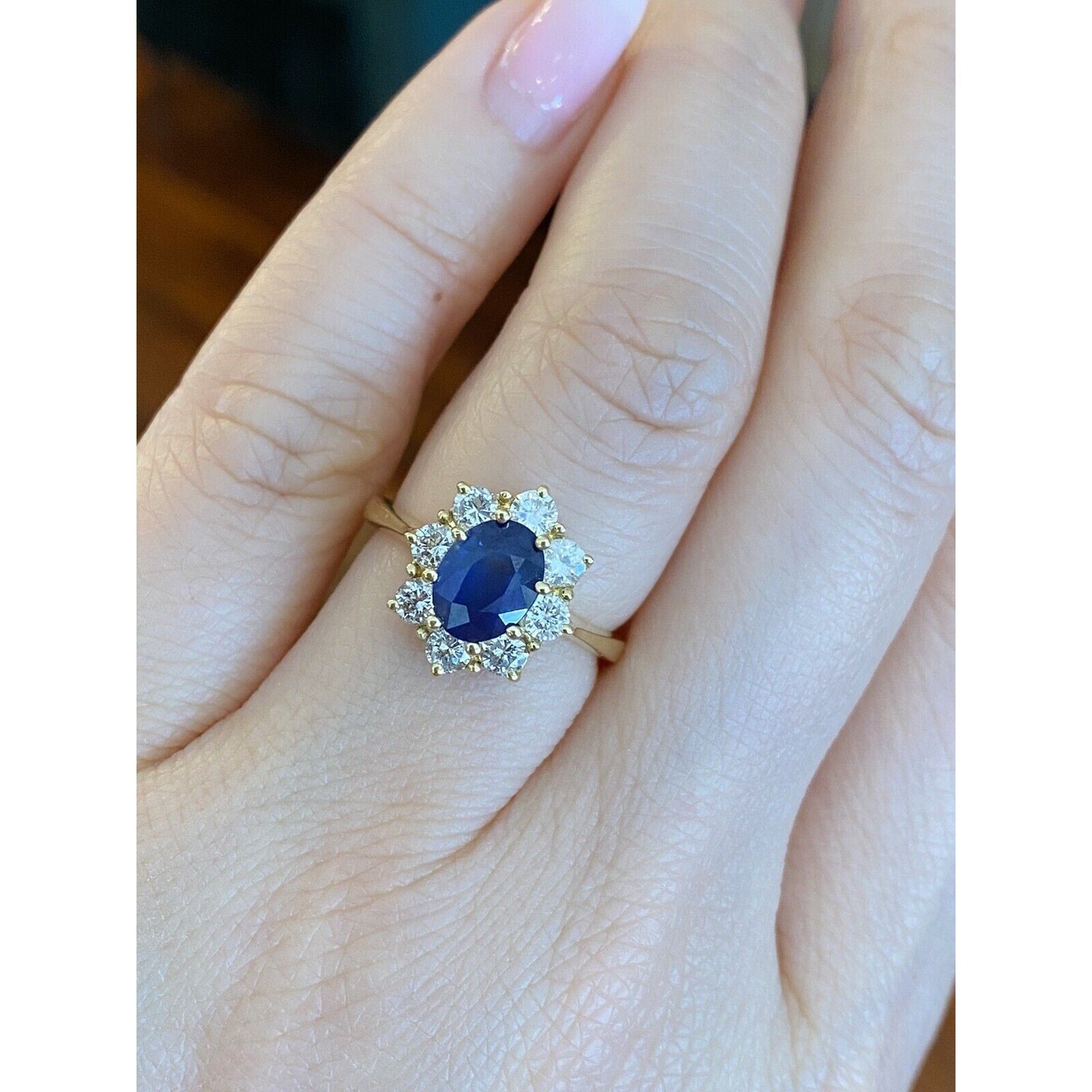 1.63 carat Oval Sapphire and Diamond Halo Ring in 18k Yellow Gold