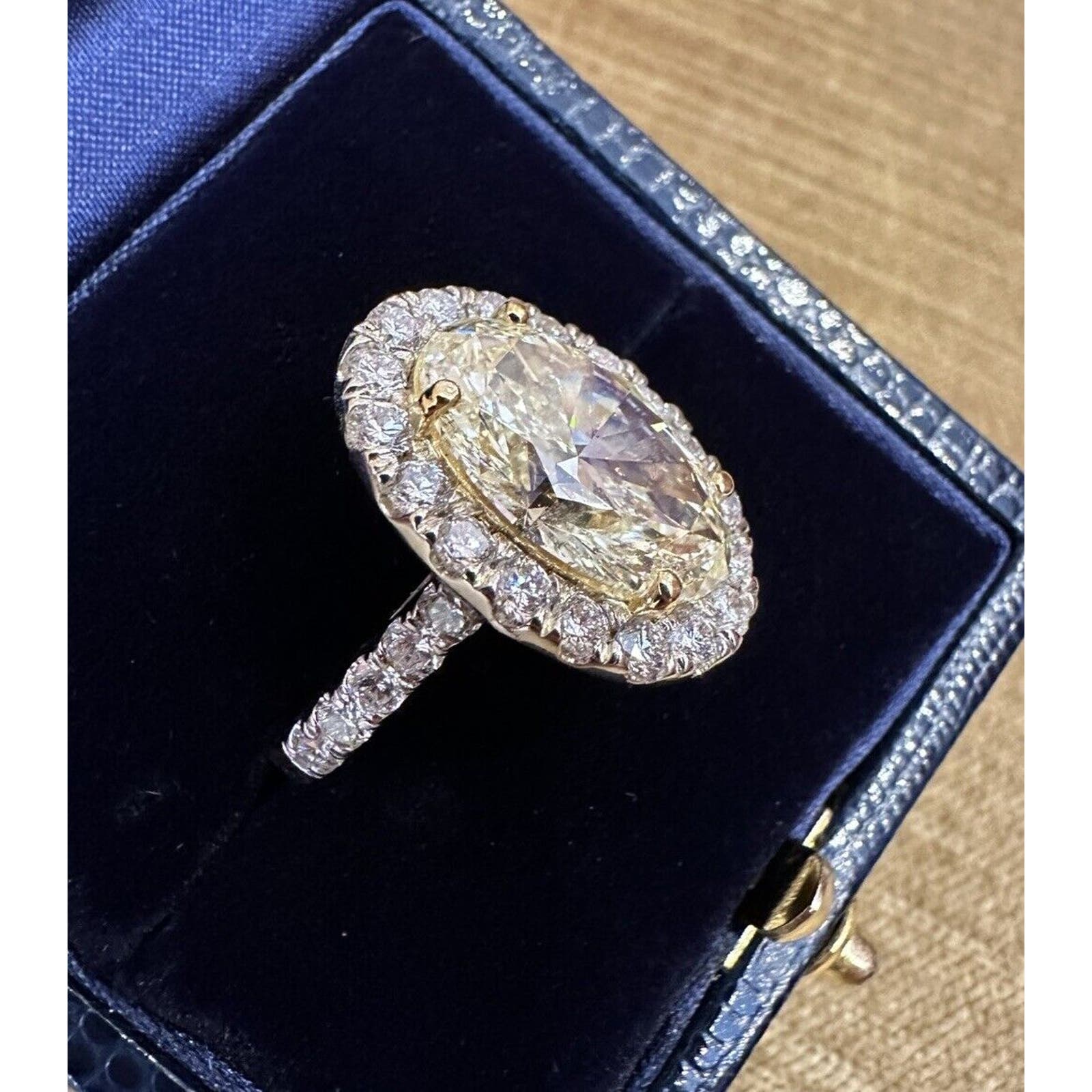 GIA 6.05 carat Oval Brilliant Yellow Diamond Halo Ring in 18k Gold - C300EB