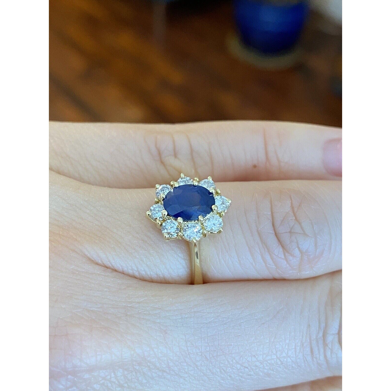 1.63 carat Oval Sapphire and Diamond Halo Ring in 18k Yellow Gold