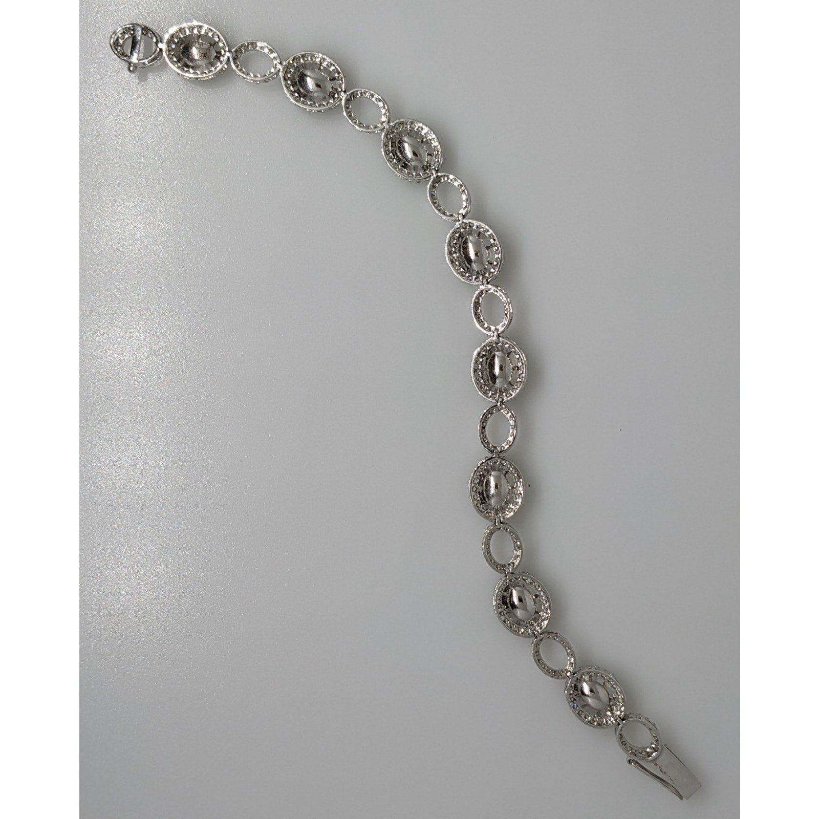 GIA Oval Emerald and Diamond Link Bracelet in 18k White Gold