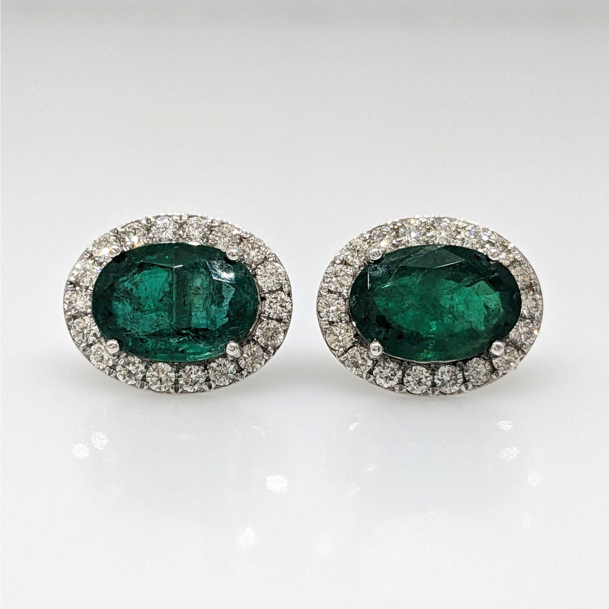 Natural Emerald Oval Stud Earrings with Diamonds in 14k White Gold