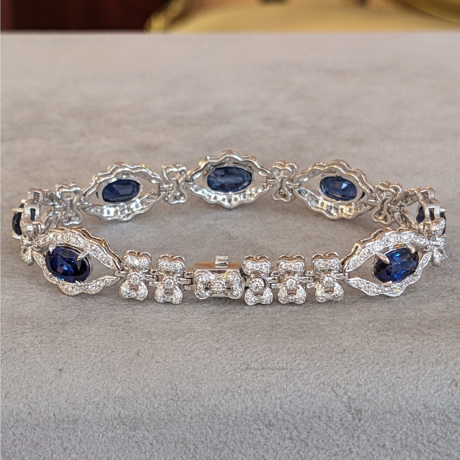 Blue Sapphire and Diamond Station Bracelet with Bows in Platinum