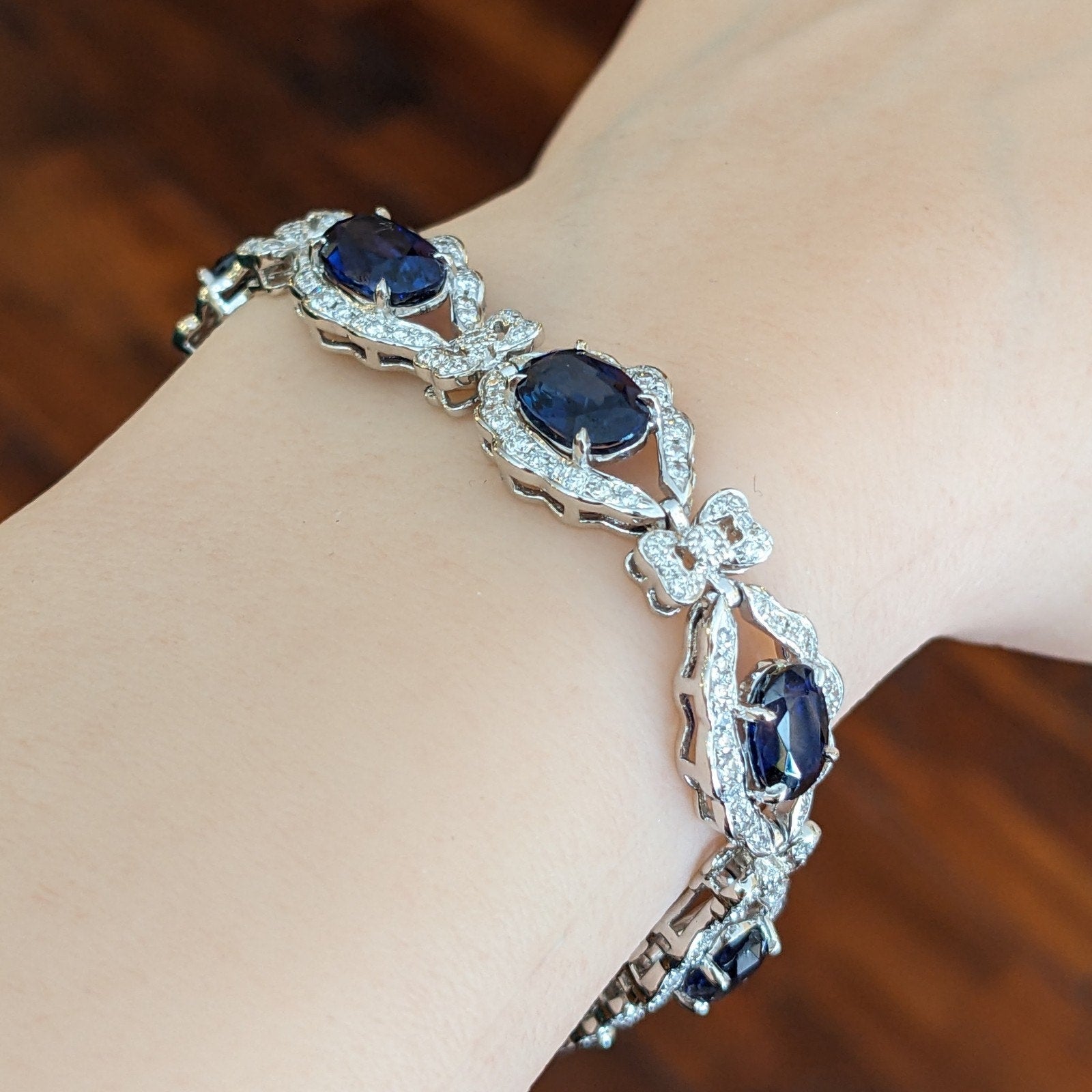 Blue Sapphire and Diamond Station Bracelet with Bows in Platinum