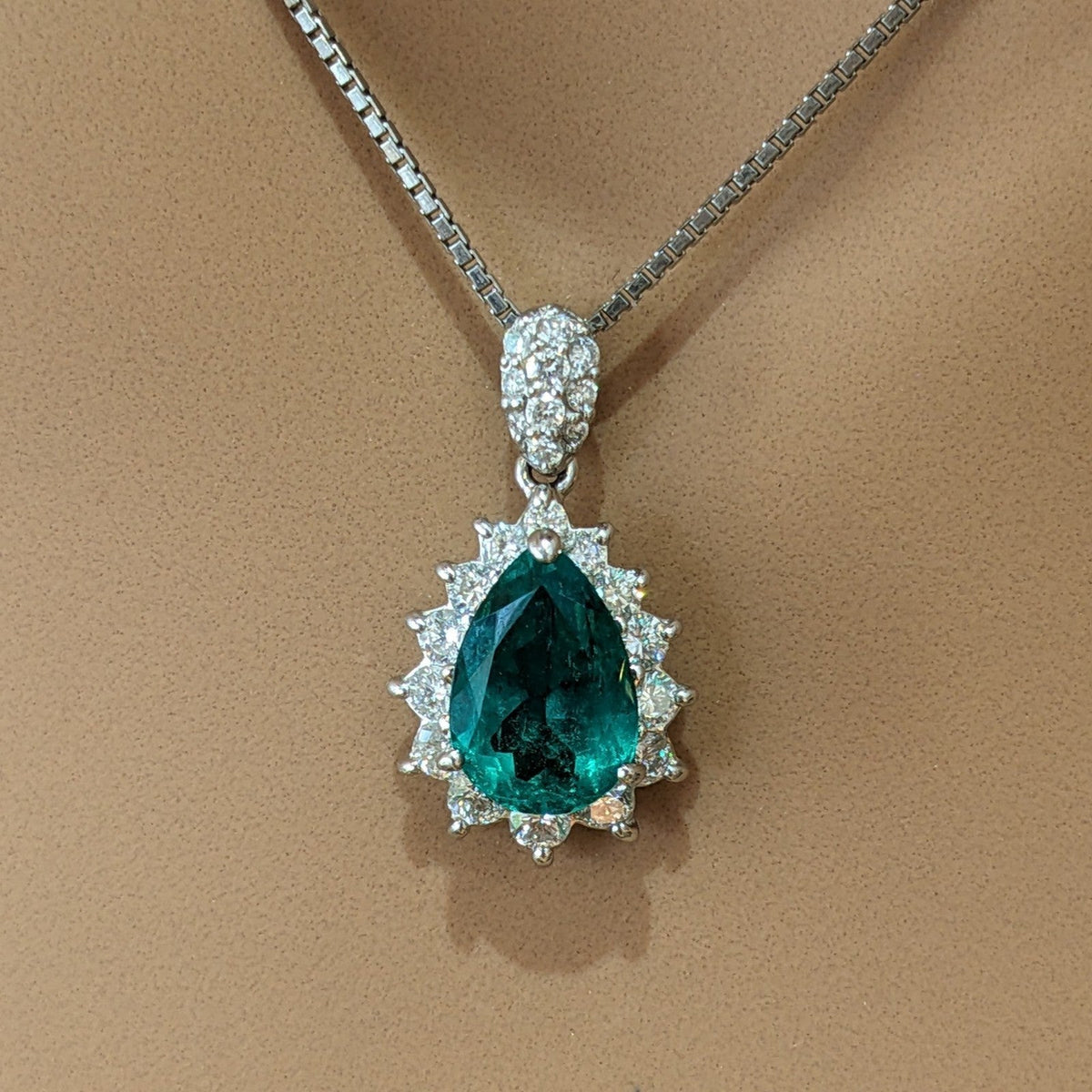 Pear Shaped Emerald and Diamond Halo Pendant Necklace in Platinum