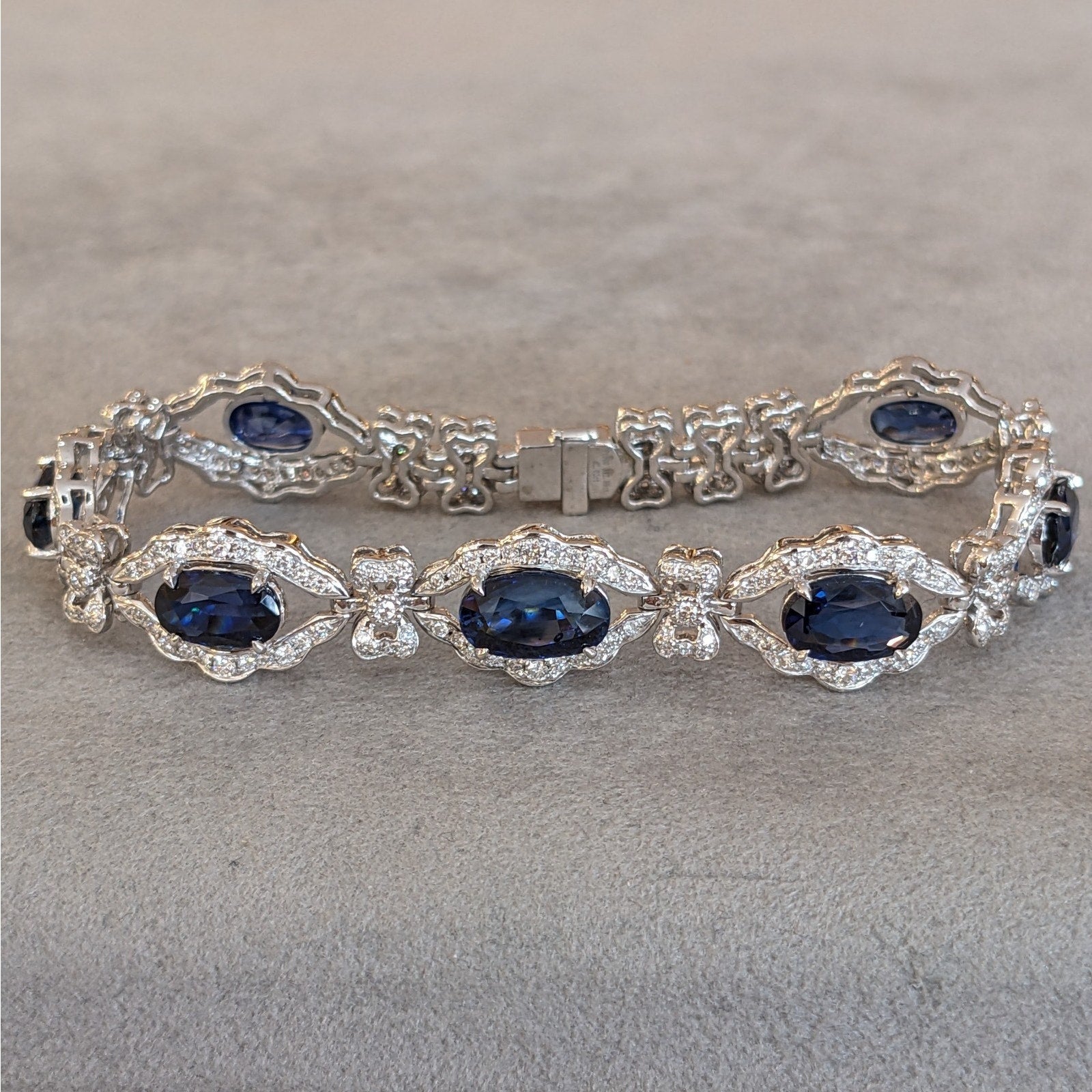 Blue Sapphire and Diamond Station Bracelet with Bows in Platinum
