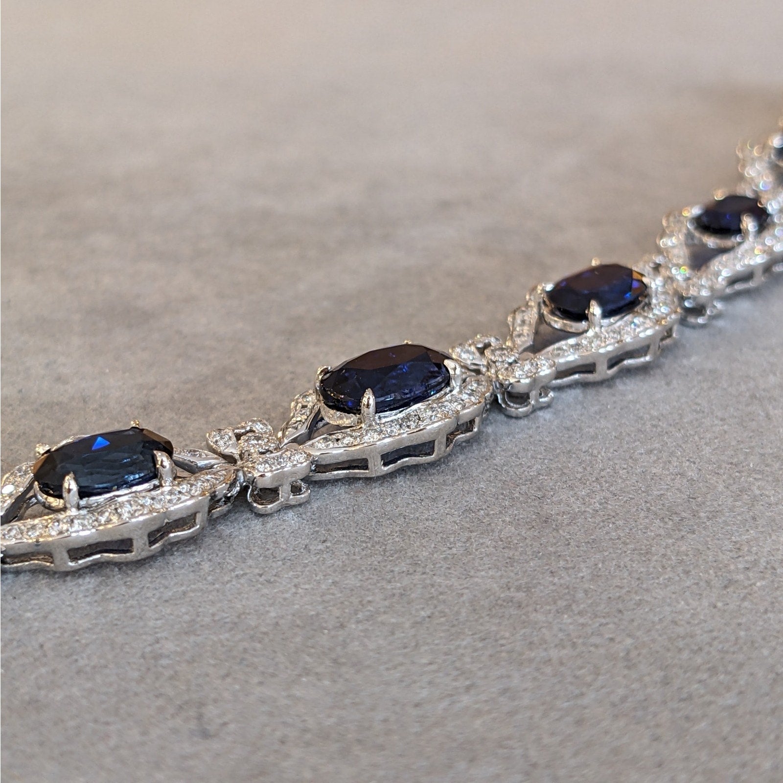 Blue Sapphire and Diamond Station Bracelet with Bows in Platinum