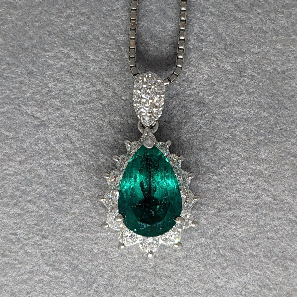 Pear Shaped Emerald and Diamond Halo Pendant Necklace in Platinum