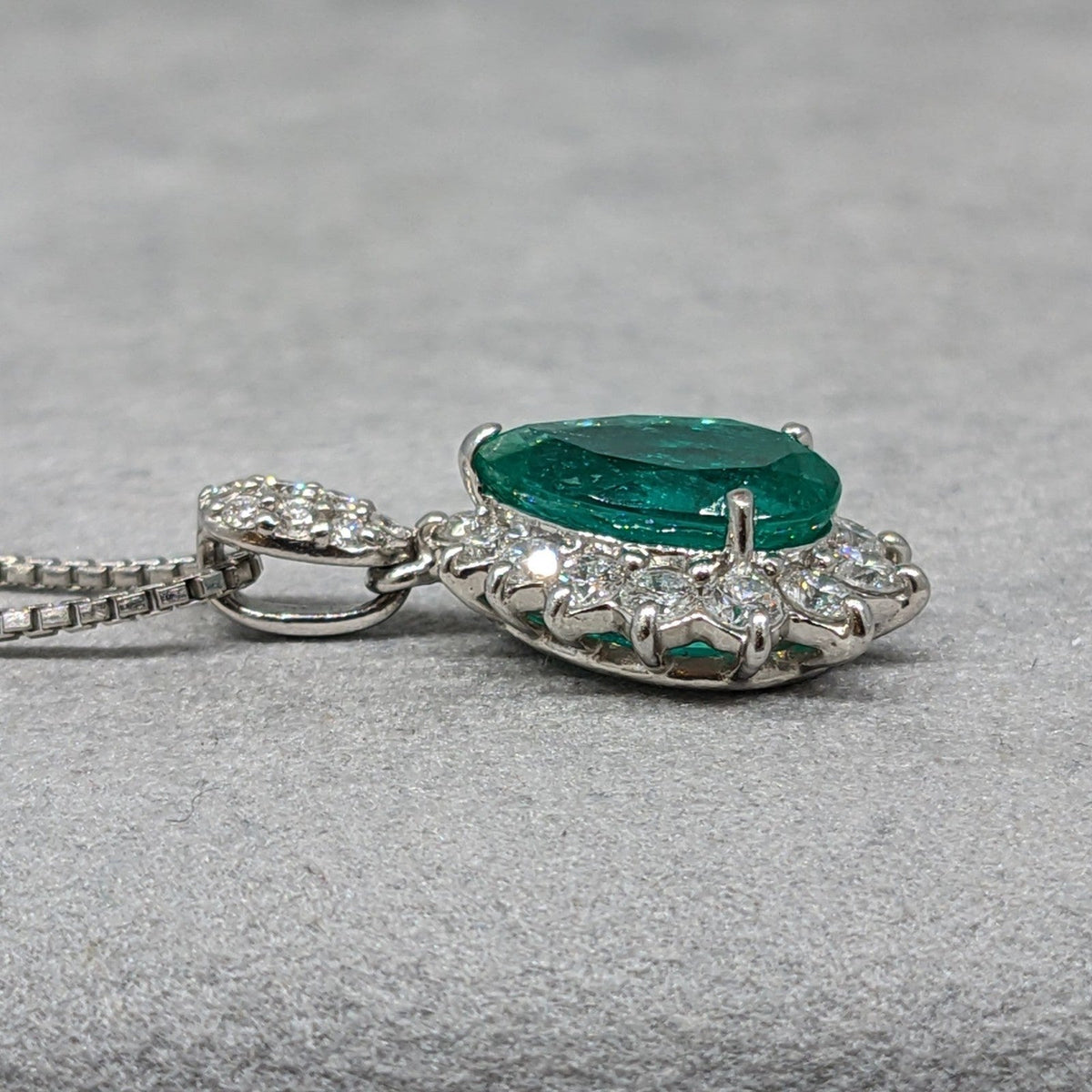 Pear Shaped Emerald and Diamond Halo Pendant Necklace in Platinum
