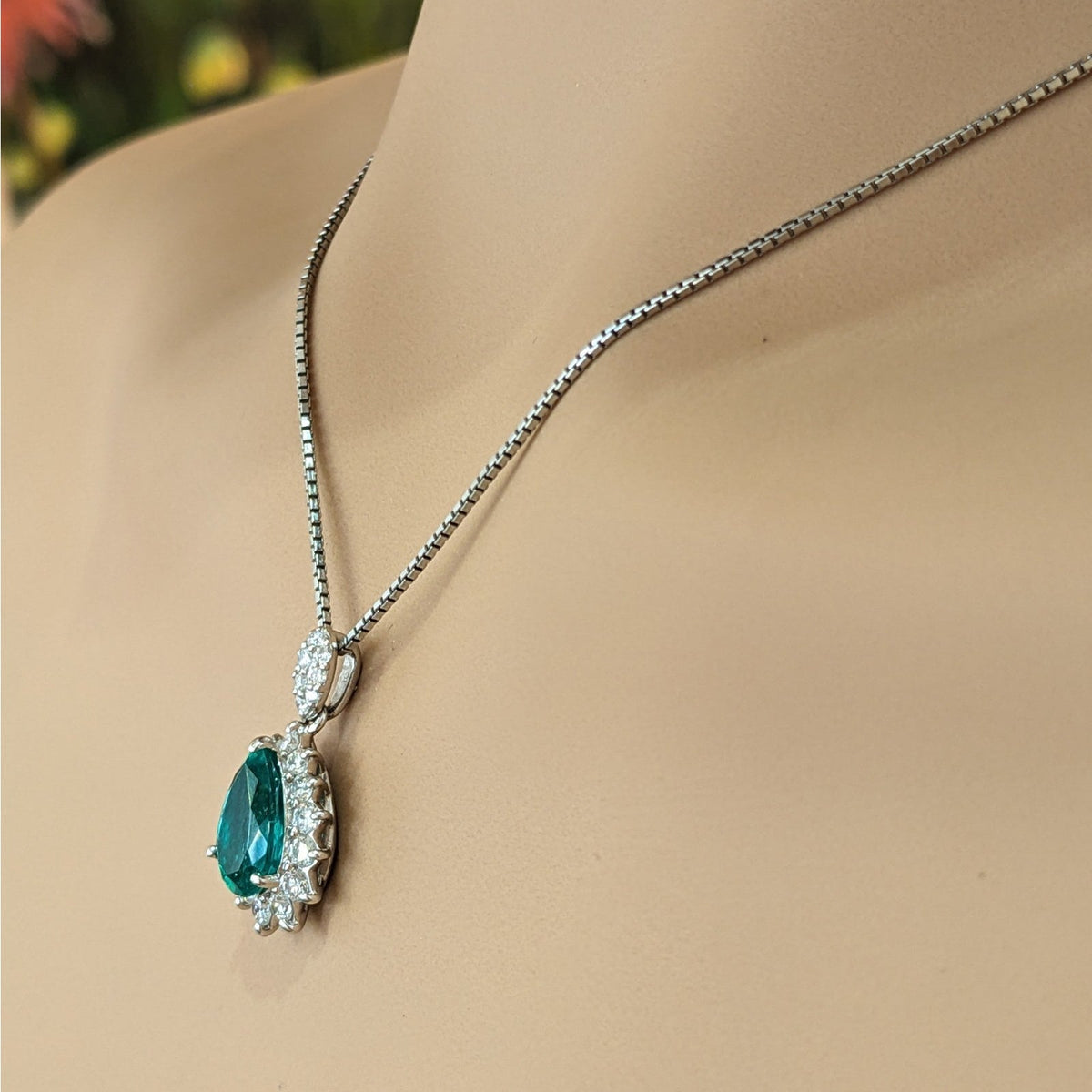 Pear Shaped Emerald and Diamond Halo Pendant Necklace in Platinum