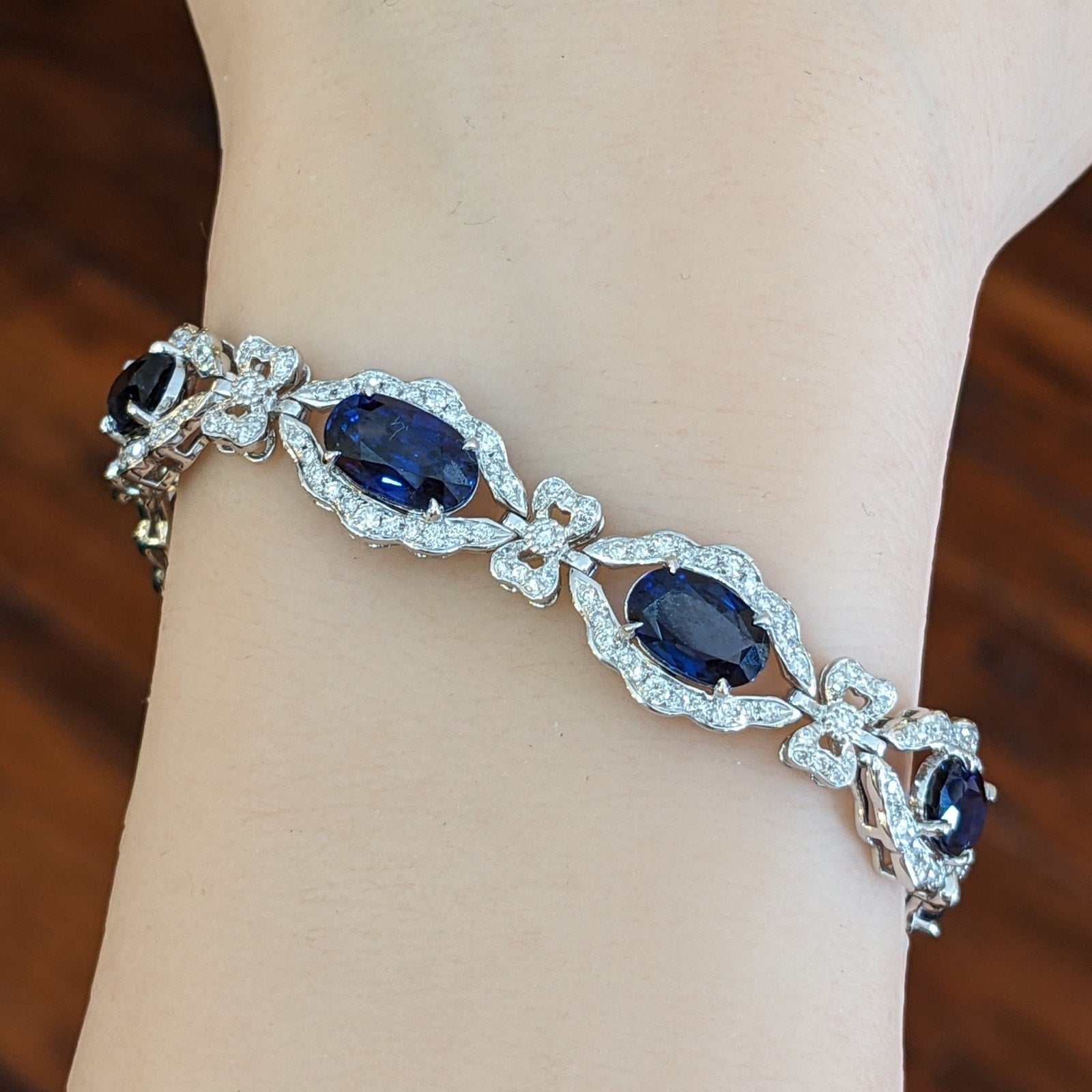 Blue Sapphire and Diamond Station Bracelet with Bows in Platinum