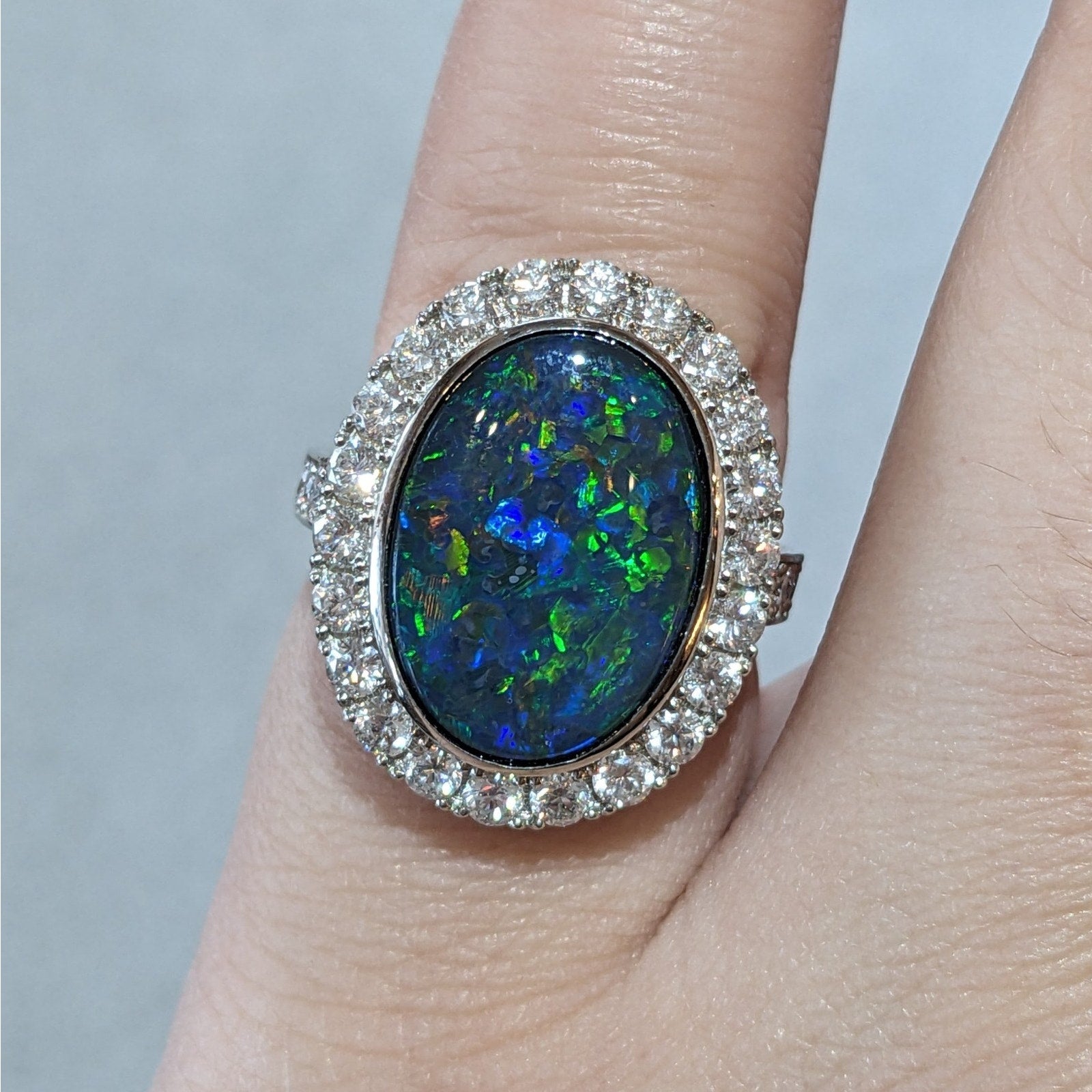 6.31 cts. Natural Black Opal and Diamond Halo Ring in Platinum
