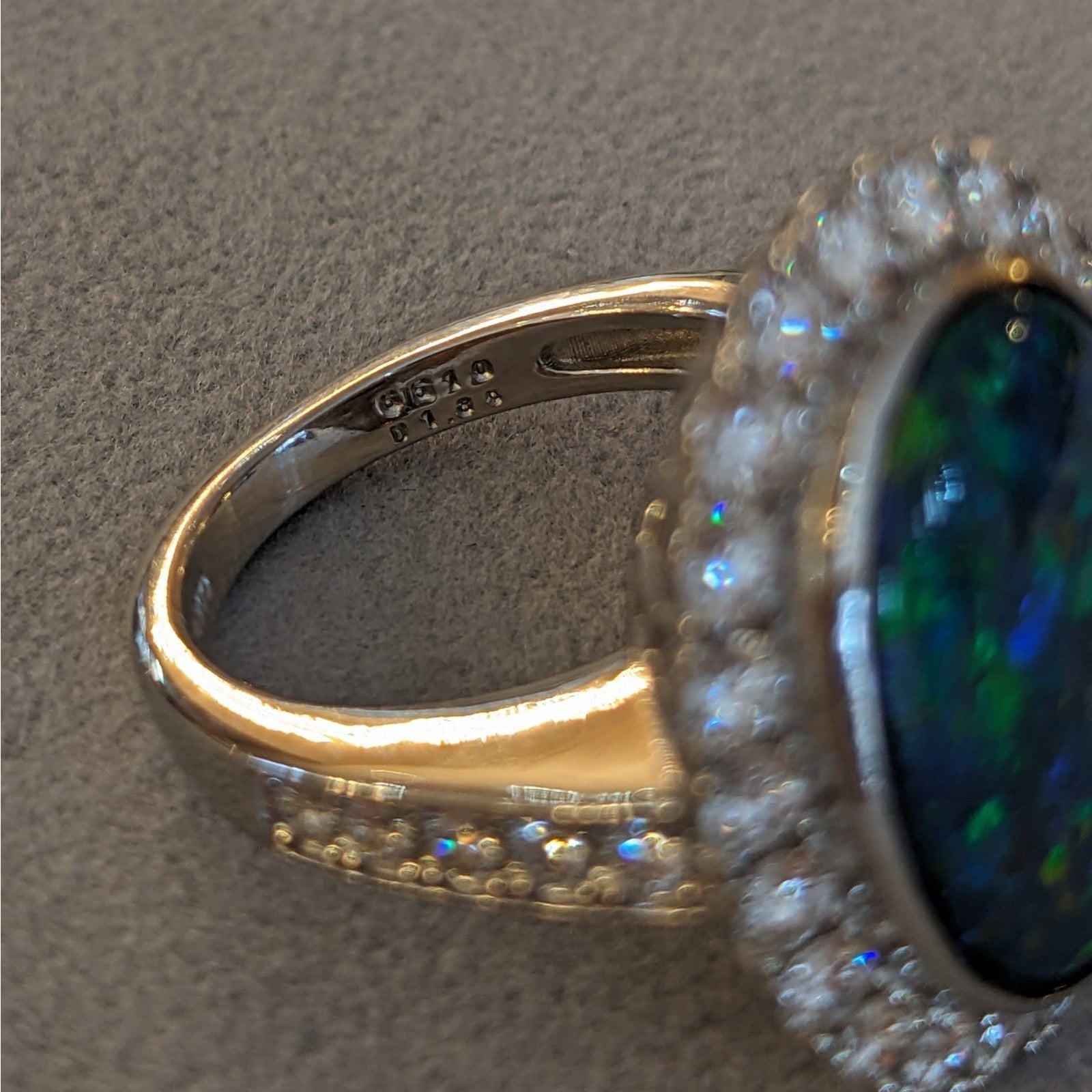 6.31 cts. Natural Black Opal and Diamond Halo Ring in Platinum