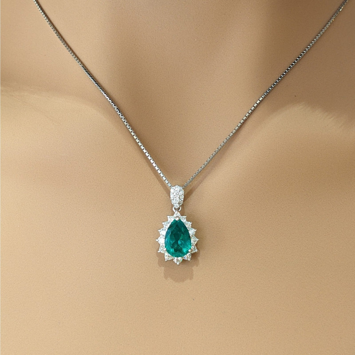 Pear Shaped Emerald and Diamond Halo Pendant Necklace in Platinum