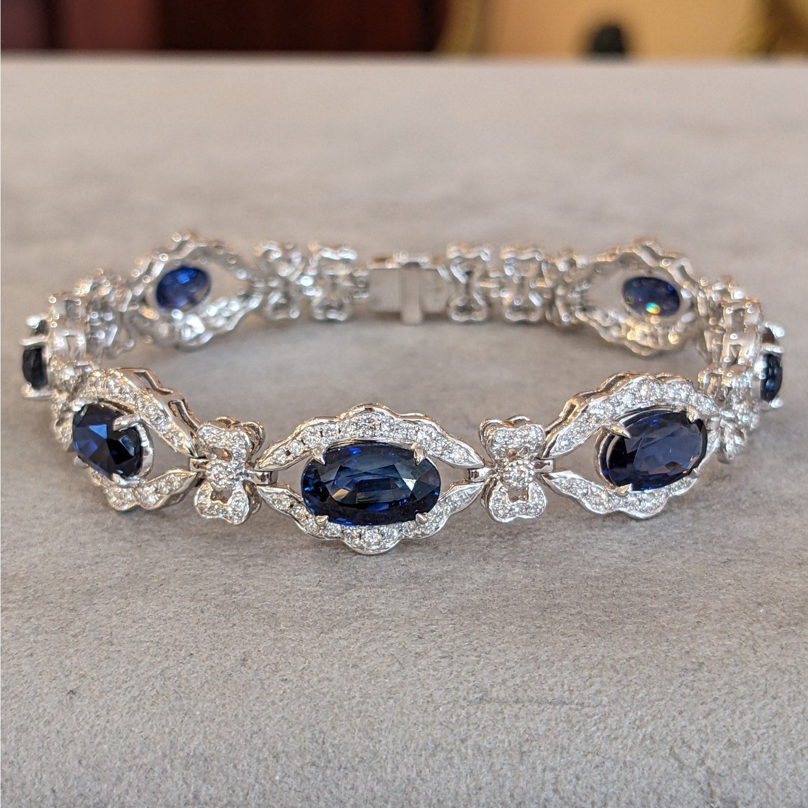 Blue Sapphire and Diamond Station Bracelet with Bows in Platinum